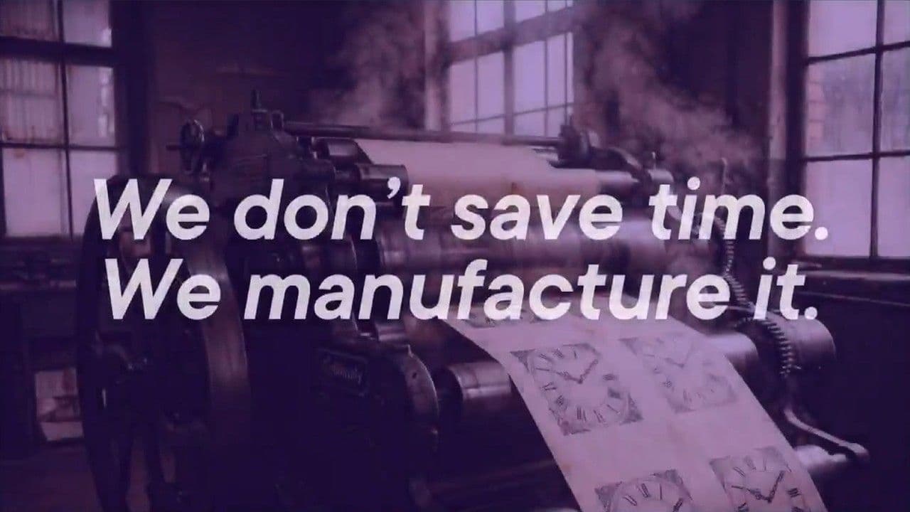 Industrial printing press in a factory setting with the text We don't save time. We manufacture it overlaid in white.